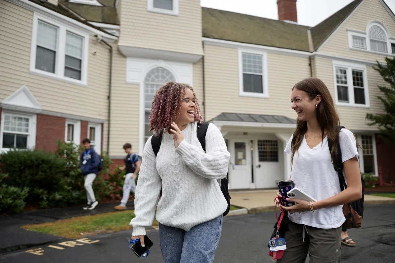 students outside of school building